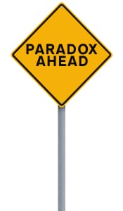 Leadership speaker and author, Bob Vanourek, uses this picture of a paradox ahead sign to show paradoxes in leadership.