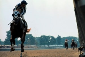 Leadership writers and speakers Bob and Gregg Vanourek use a picture of Secretariat to show the accomplishment and difficulty of becoming a triple crown leader.