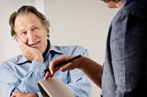 Leadership speakers and authors, Bob Vanourek and Gregg Vanourek, use the image of an older gentleman listening intently to a co-worker to show the importance of transparency.